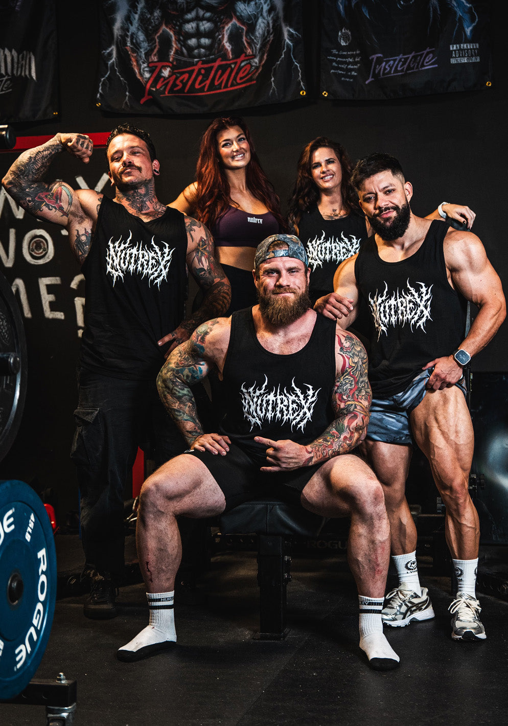 Group of Nutrex athletes wearing brand tank tops in gym